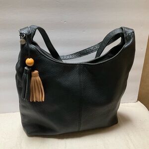 The SAK Huntley Hobo Bag Black Leather slouch shoulder bag black & tan tassels